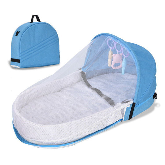 Blue baby bassinet with canopy and backpack on a white background