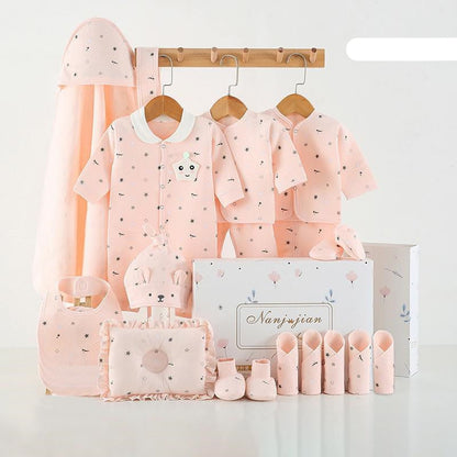 Baby clothing set with pink outfits, hats, and accessories on a white background.