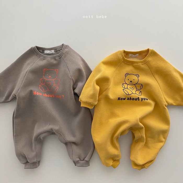 Two children's sweatshirts, one brown and one yellow, with teddy bear graphics on a light gray background.