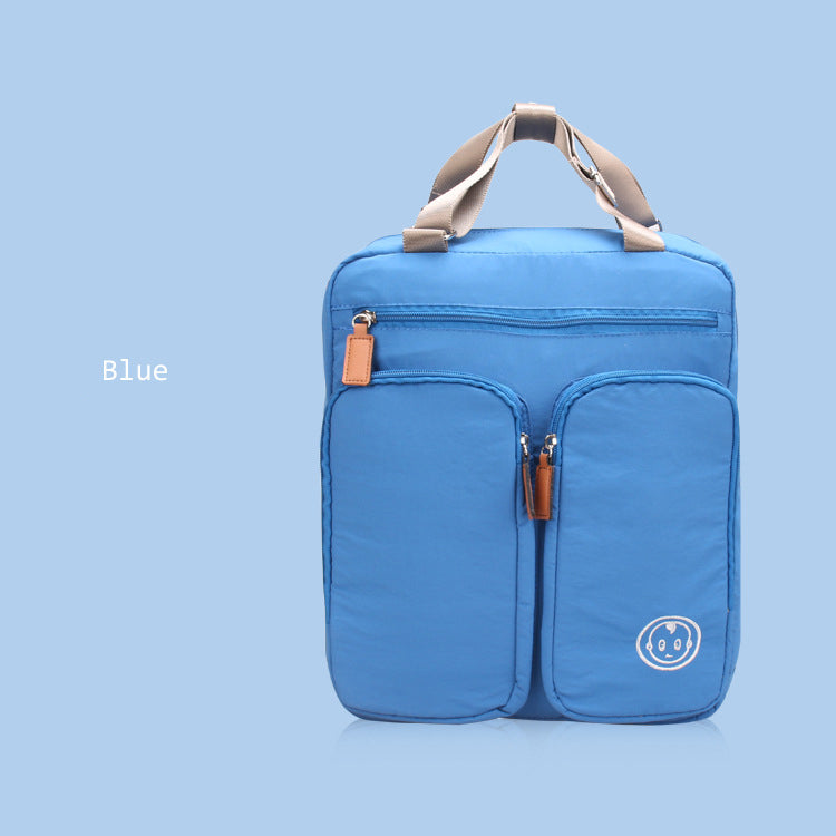 Blue backpack with a smiley face logo on a light blue background