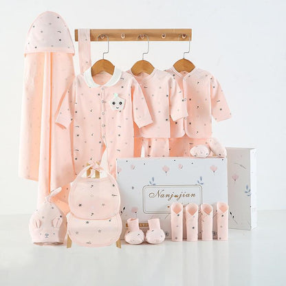 Baby clothing set with pink outfits, hats, and bags on a white background