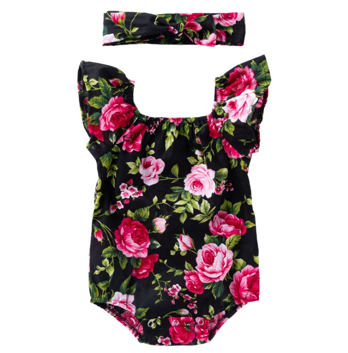 Floral baby romper with matching headband on a white background