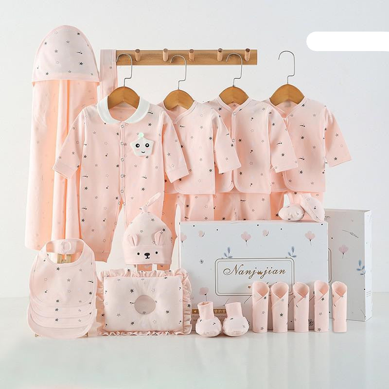 Baby clothing set with pink outfits, hats, and accessories on a white background.