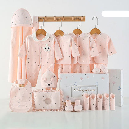 Baby clothing set with pink outfits, hats, and accessories on a white background.