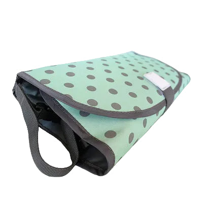 Mint green bag with brown polka dots on a light gray background