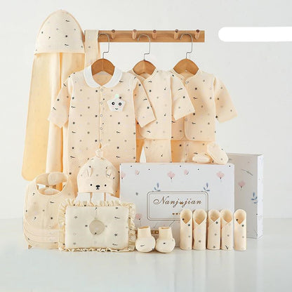 Collection of baby clothing and accessories on a white background with 'warm' text.