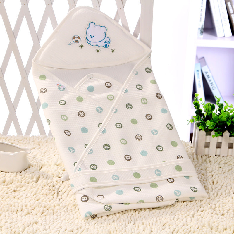 Baby swaddle with cartoon design on a textured surface