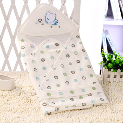 Baby swaddle with cartoon design on a textured surface