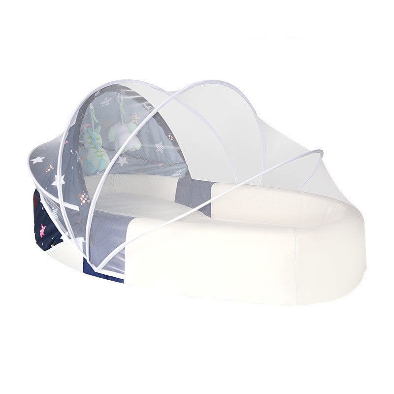 Baby crib with a canopy and mattress on a white background