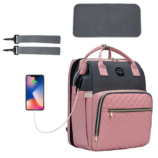 Pink and gray backpack with accessories on a white background