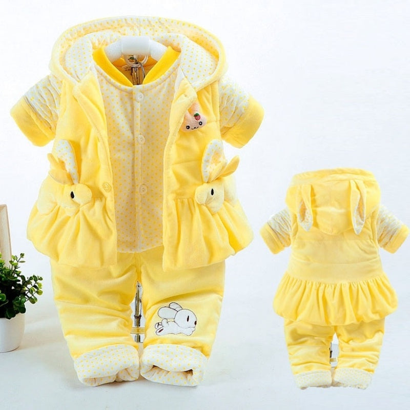 Yellow baby outfit with bear design on a white background