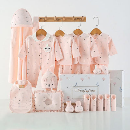 Baby clothing set with pink outfits, hats, and accessories on a white background