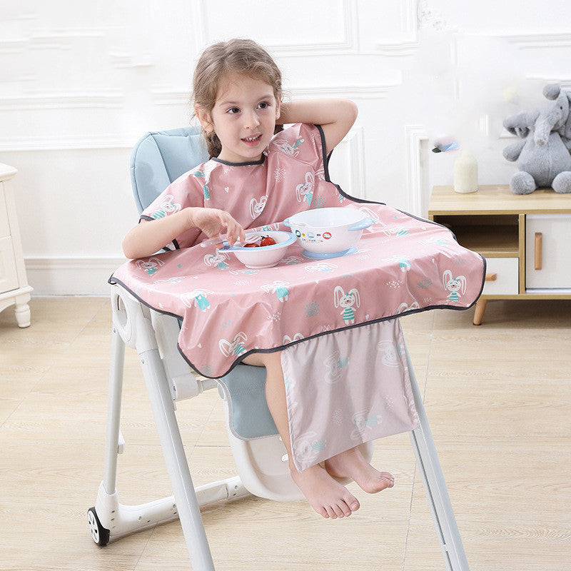 Child sitting in a high chair with a pink bib and tray, eating.