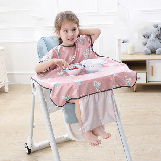 Child sitting in a high chair with a pink bib and tray, eating.