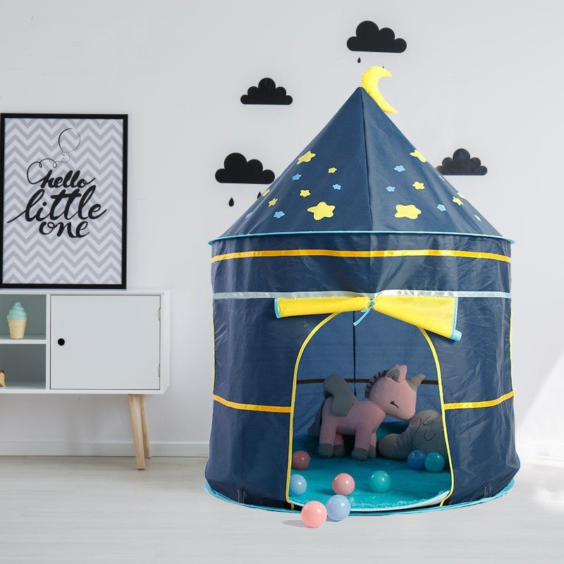 Children's play tent with toys inside, placed against a wall with decorative elements.