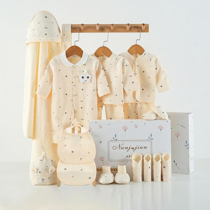 Baby clothing set with hats, rompers, and booties displayed on a white background.