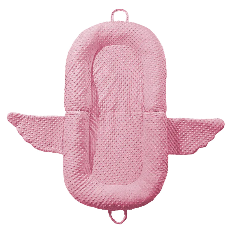 Pink baby nest with dimensions 95*55cm on a beige background