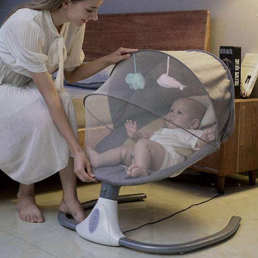 Woman adjusting a baby swing with a baby inside, in a home setting.